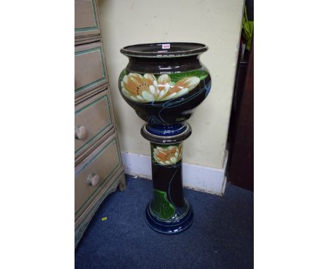 An Art Nouveau pottery jardiniere and pedestal, both inscribed 'R Dean', total height 83cm. 