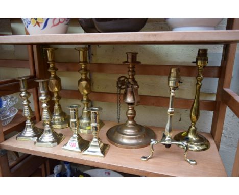 Three pairs of 19th century brass candlesticks, largest 29cm; together with another cast bell metal candlestick, with bell co