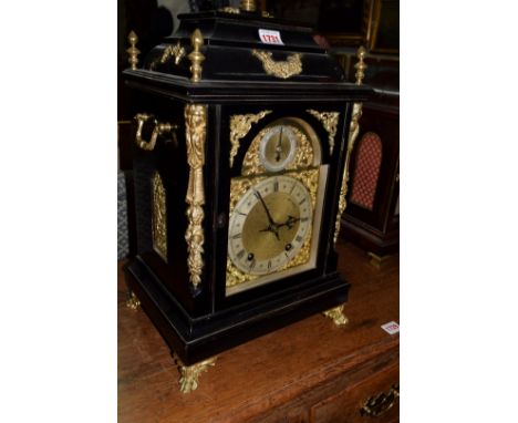 A Victorian ebonized and brass mounted bracket type clock, striking on two gongs, 54.5cm high.  Condition Report: The general