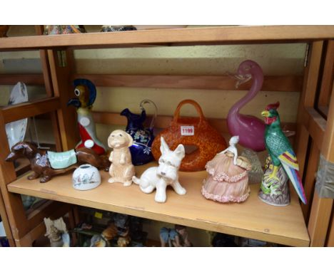 A mixed lot of ceramics, to include two Sylvac dogs; a porcelain half-doll; a Chinese famille rose inkwell; and other coloure