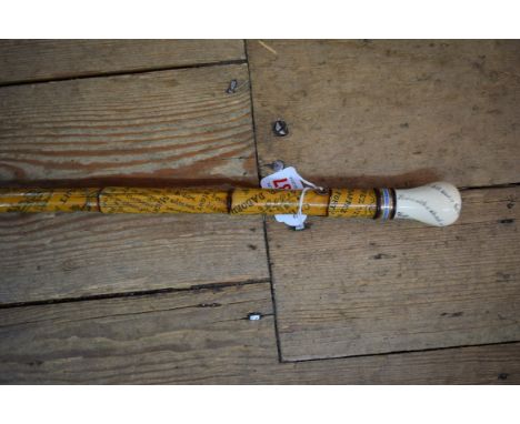 An late 19th century ivory, bamboo and enamel walking cane, the whole pokerwork decorated with mottos and similar inscription