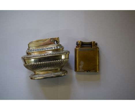 A Dunhill electroplated lighter; and another Ronson Queen Anne table lighter.