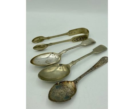 Silver sugar tongs and three spoons 