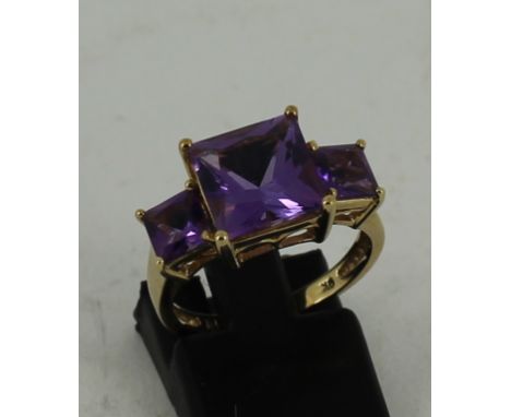 9ct yellow gold ring with 3 Amethyst coloured stones size:M/N