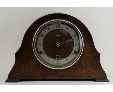 An oak cased chiming mantle clock 