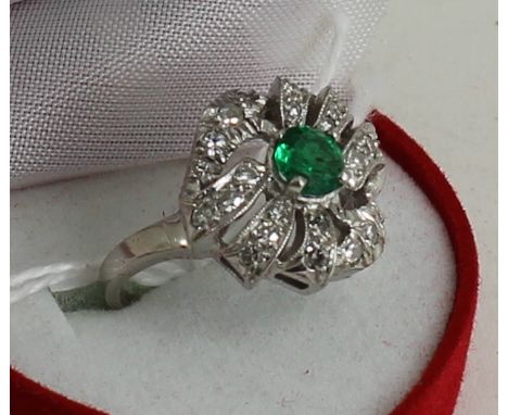 Platinum set emerald and diamond ring 