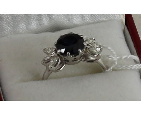 Platinum set sapphire and diamond ring 