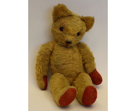 An early Teddy Bear with a growler 