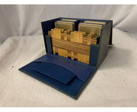 A VINTAGE LEATHER BOXED SET OF PLAYING CARDS AND MARKERS 