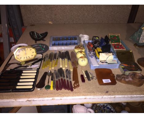 AN ASSORTMENT OF ITEMS TO INCLUDE STATIONARY, FLATWARE, TWO WRIST WATCHES, THREE POMANDERS, A BRASS TRAVELLERS CLOCK ETC 