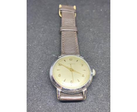 A JUNGHANS VINTAGE GERMAN WRIST WATCH WITH BROWN LEATHER STRAP IN WORKING ORDER 