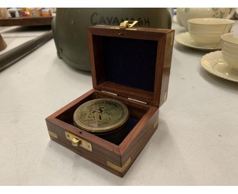 A SMALL BOXED BRASS BOY SCOUT COMPASS 