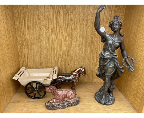 A METAL FIGURE OF A WOMAN, A HORSE AND CART AND A CERAMIC DOG 