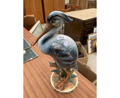 A CERAMIC FIGURE OF A PELICAN (H:40CM) 