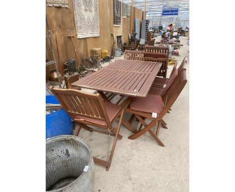 A TEAK GARDEN FURNITURE SET TO INCLUDE A TABLE AND SIX FOLDING CHAIRS (TABLE TOP 160CM X 90CM) 