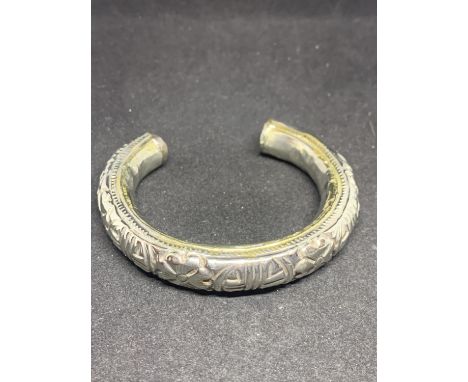 A HEAVY ASIAN SILVER BANGLE 