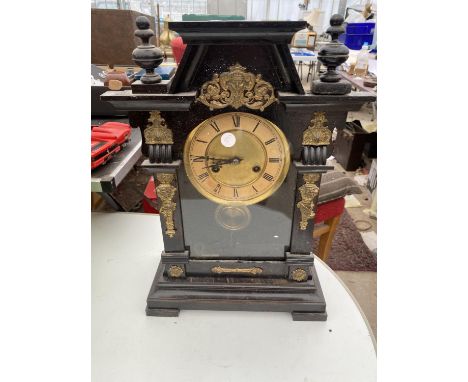 A DECORATIVE MANTEL CLOCK WITH GILT DETAILING 