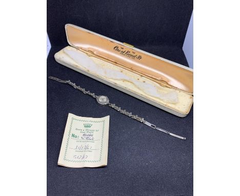 A DELICATE AND ELABORATE LADIES WRISTWATCH WITH 17 JEWEL MOVEMENT, 925 SILVER AND DIAMANTE CASE AND STRAP, TOGETHER WITH ORIG