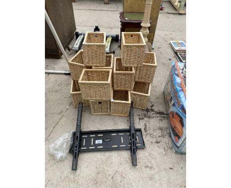 A TV BRACKET AND A QUANTITY OF WICKER STORAGE BOXES 