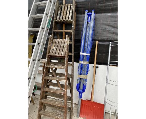 A VINTAGE WOODEN EIGHT RUNG STEP LADDER AND A VINTAGE FIVE RUNG WOODEN STEP LADDER 