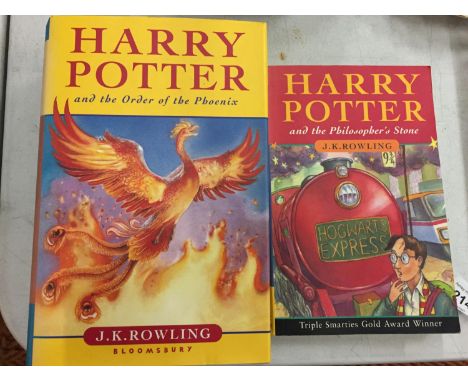 A HARDBACK FIRST EDITION BOOK 'HARRY POTTER AND THE ORDER OF THE PHOENIX' AND A PAPERBACK 'HARRY POTTER AND THE PHILOSOPHER'S