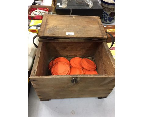 A VINTAGE GAME KEEPER'S PINE BOX WITH CLAY PIGEONS AND EMPTY CARTRIDGES 