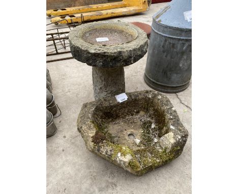 A STONE BIRD BATH AND A FURTHER STONE PLANTER 