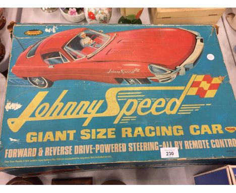 A VINTAGE TOPPER TOYS JOHNNY SPEED E-TYPE JAGUAR MODEL CAR TO INCLUDE THE ORIGINAL DRIVER AND BOX AND A NEW BATTERY 