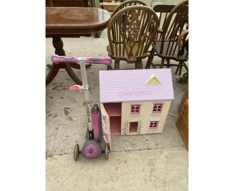 A WOODEN DOLLS HOUSE AND A CHILDS SCOOTER 