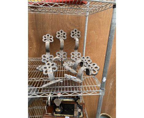 A QUANTITY OF DECORATIVE CAST IRON DRAIN PIPE BRACKETS 