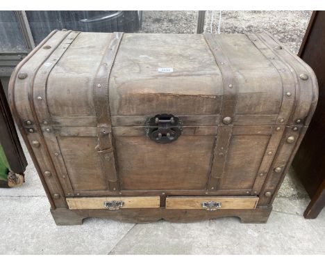 A RECTANGULAR LEATHER BOUND TRUNK WITH 2 DRAWERS TO BASE25" WIDE 
