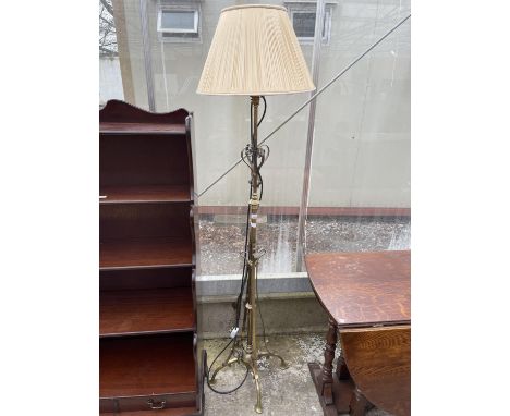 AN ART NOUVEAU BRASS STANDARD LAMP WITH SHADE 