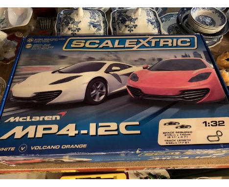 A SCALEXTRIC MCLAREN MP4-12C IN ORIGINAL BOX 
