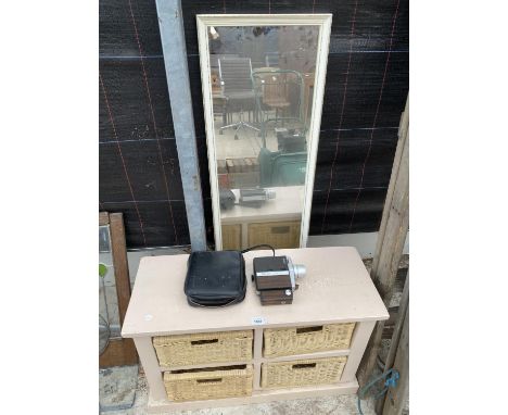 A WOODEN STORAGE UNIT WITH WICKER BASKETS, A WOODEN FRAMED MIRROR AND A BELL &amp; HOWELL CAMERA 