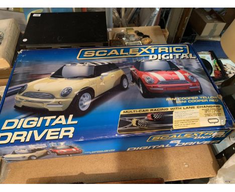 A SCALEXTRIC DIGITAL DRIVER MINI COOPER IN ORIGINAL BOX 