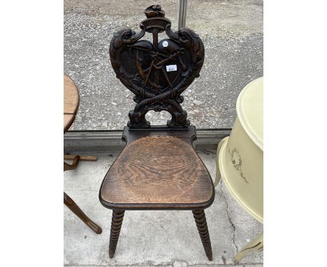 A LATE VICTORIAN OAK HALL CHAIR WITH MARITIME CARVED BACK FEATURING ANCHOR AND FISH, ON BOBBIN TURNED LEGS 