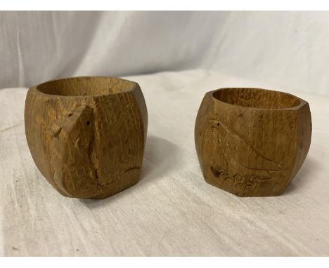 A ROBERT THOMPSON "MOUSEMAN" CARVED OAK NAPKIN RING WITH MOUSE INSIGNIA AND A MATCHING NAPKIN RING, BELIEVED BY THE SAME MAKE