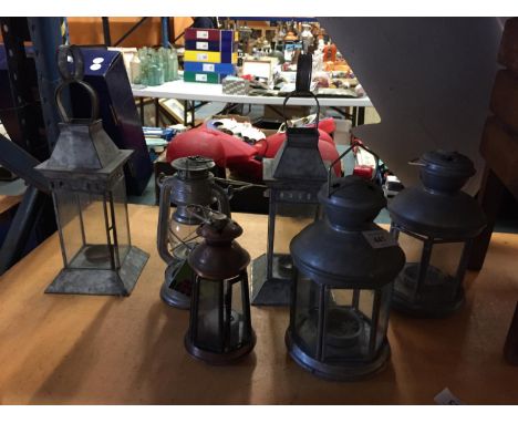 SIX HANGING METAL TEA LIGHT LAMPS 