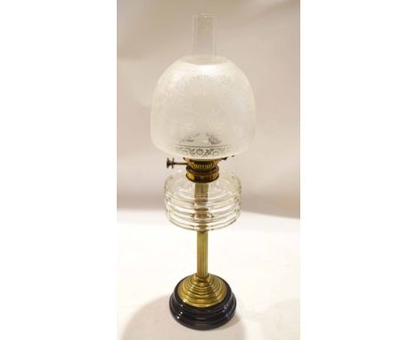 Victorian and later oil lamp, the opaque shade etched with foliage raised on a reeded brass stem and support with black slag 