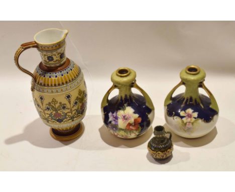 Late 19th century Mettlach jug decorated in typical fashion with a floral design, together with a miniature Lambeth Doulton f