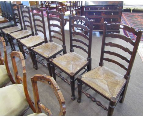 Set of six Lancashire style oak ladder back dining chairs with cord seats, turned legs and stretchers, pad feet