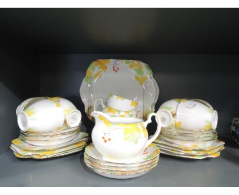 A vintage Grafton part tea service in an art deco design hand decorated
