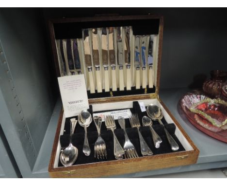 A vintage oak canteen of Cutlery by Viners