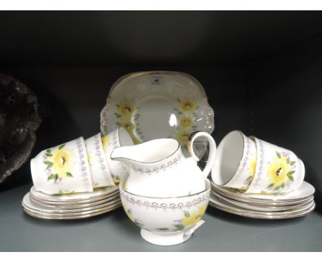 A vintage hand decorated part tea service signed Pickering to base