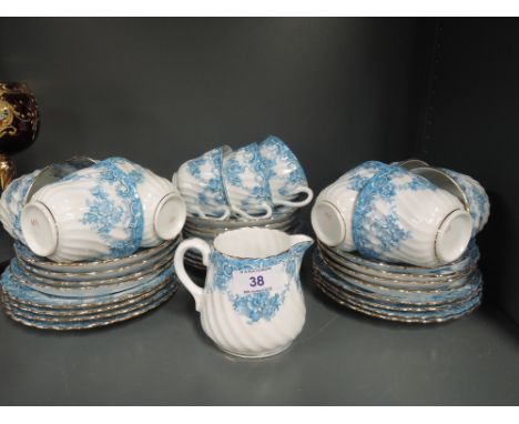 A Victorian part tea service having teal floral decoration