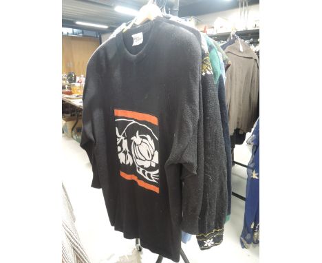 Ten items of vintage knitwear in a variety of styles and sizes.