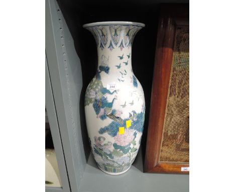 A large vintage vase with oriental design work