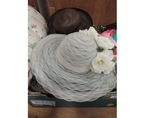 A box of vintage hats of various designs including an English panama hat by Simon Fairfax