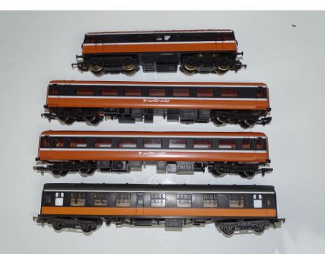 OO Gauge Model Railways: A group of LIMA Irish Outline rolling stock including a Class 33 Diesel and 3 coaches, mostly in lat