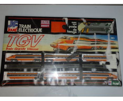 HO Gauge Model Railways: - A JOEUF French Outline TGV train set -  this item is as new and still factory sealed - however the